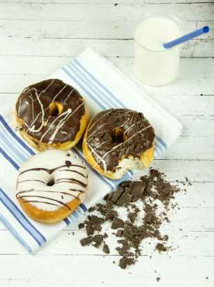 three assorted donuts with milk